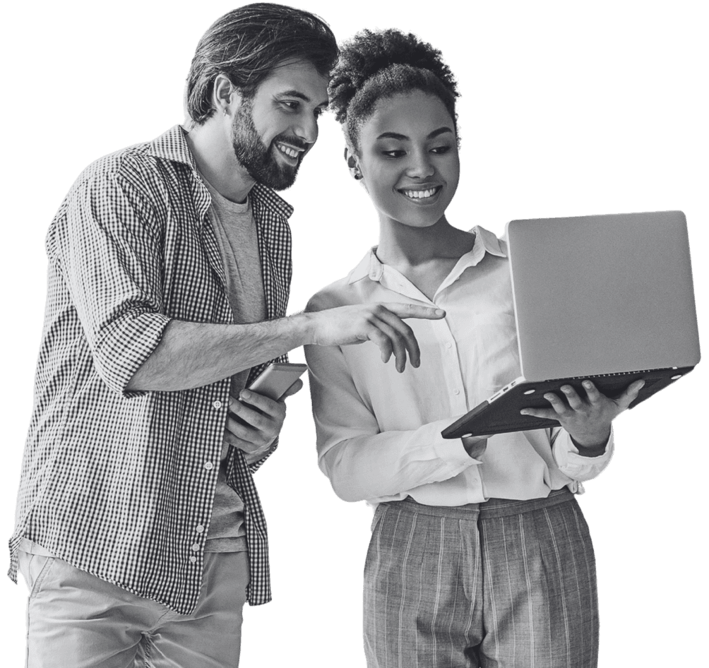 Two talent solutions colleagues reviewing work on a laptop together