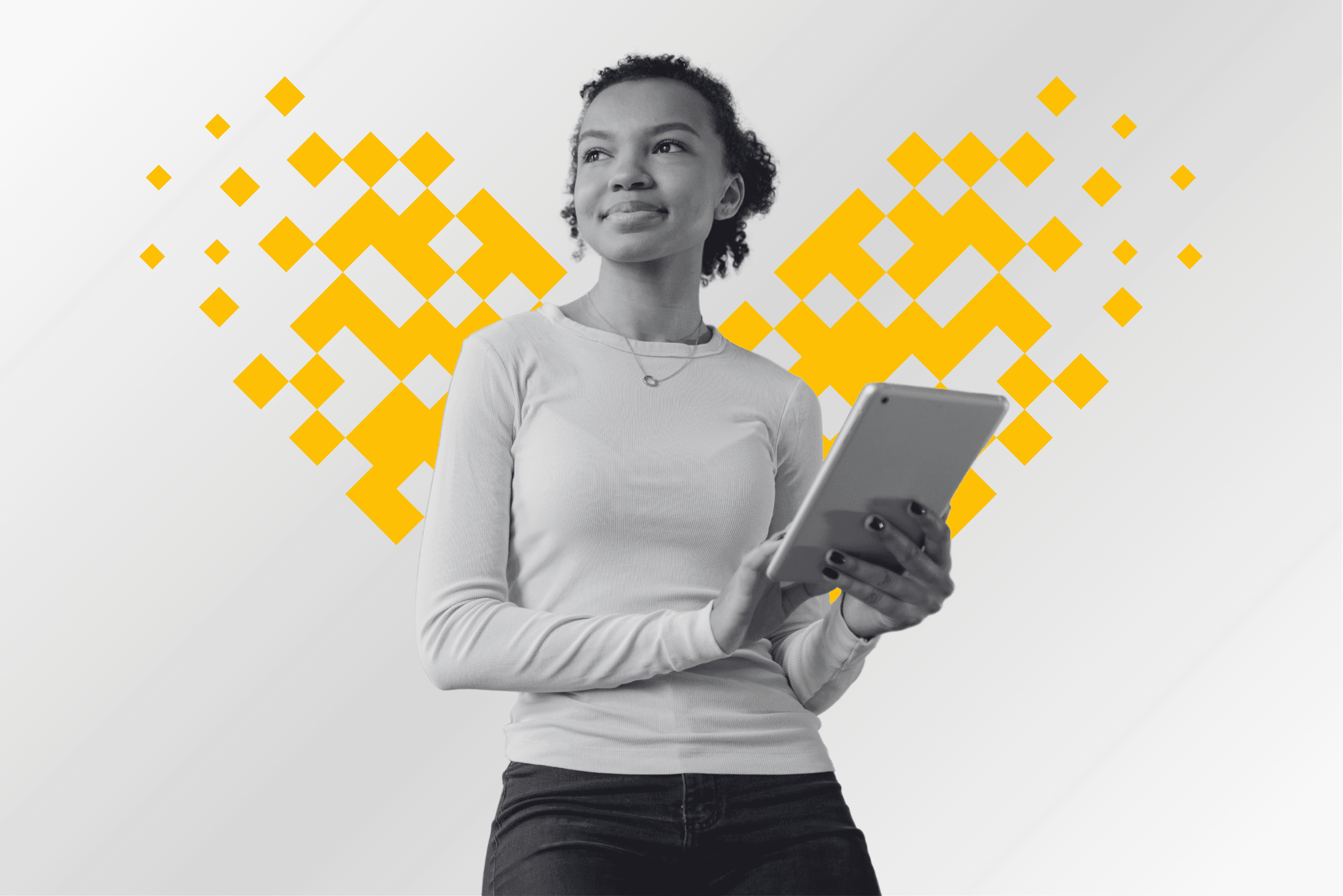 A professional holding a tablet framed by a pixel mosaic heart in yellow