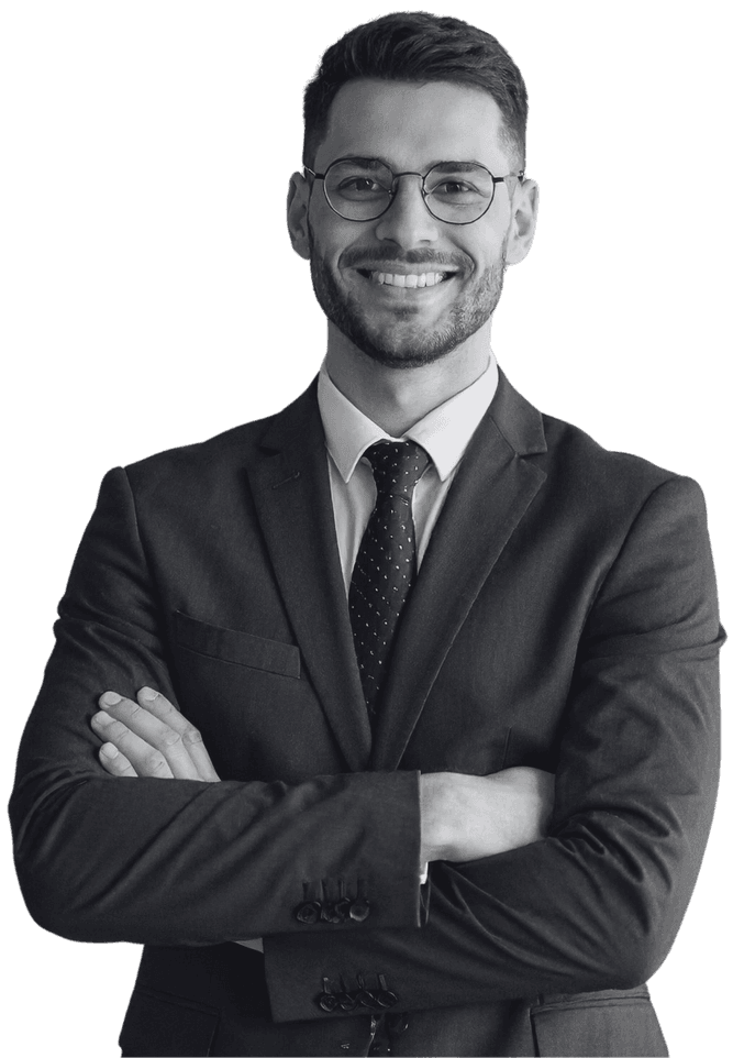 A recruitment consultant in a suit with his arms folded