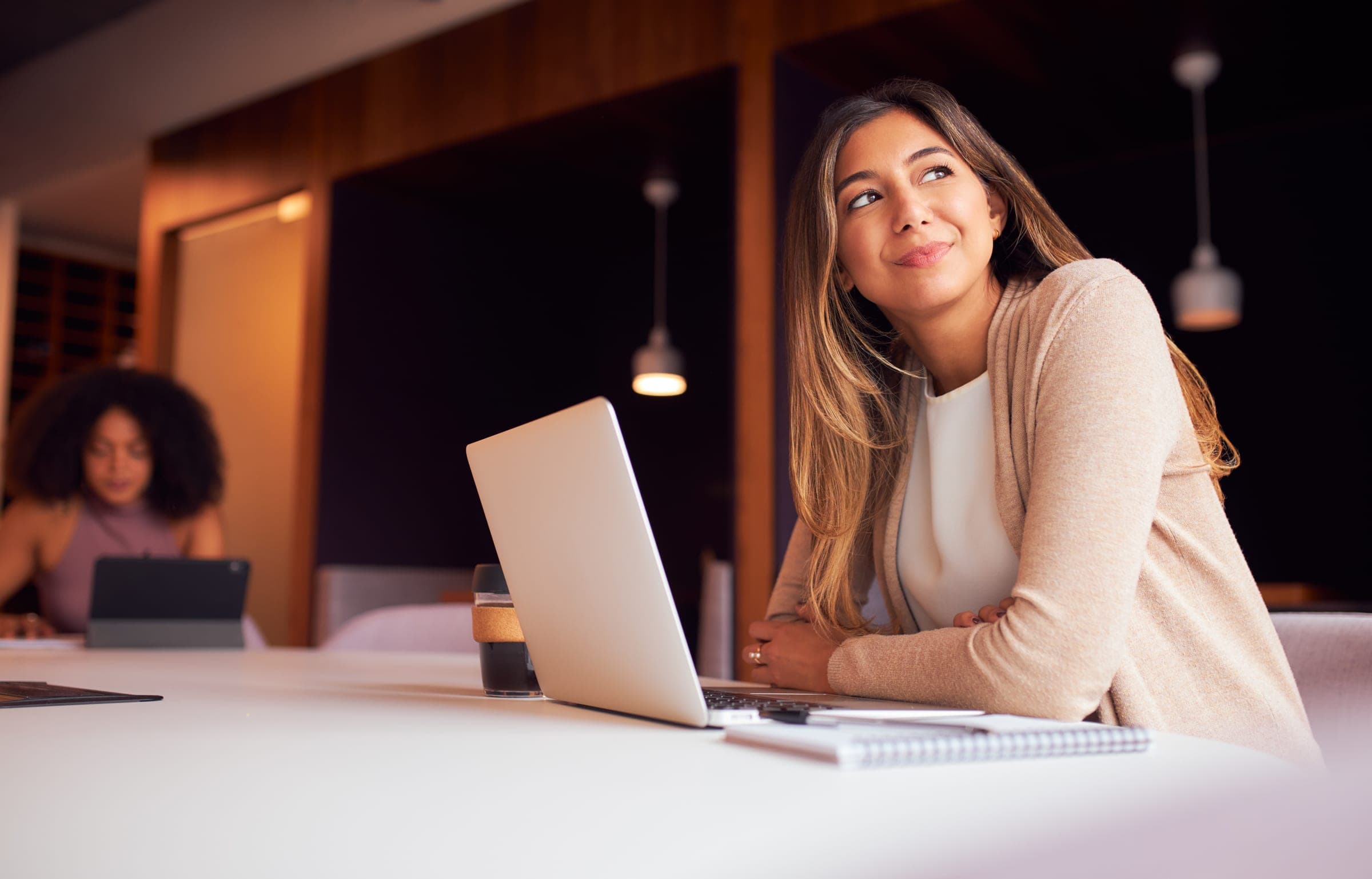 A senior leader reviewing LinkedIn activity with a laptop