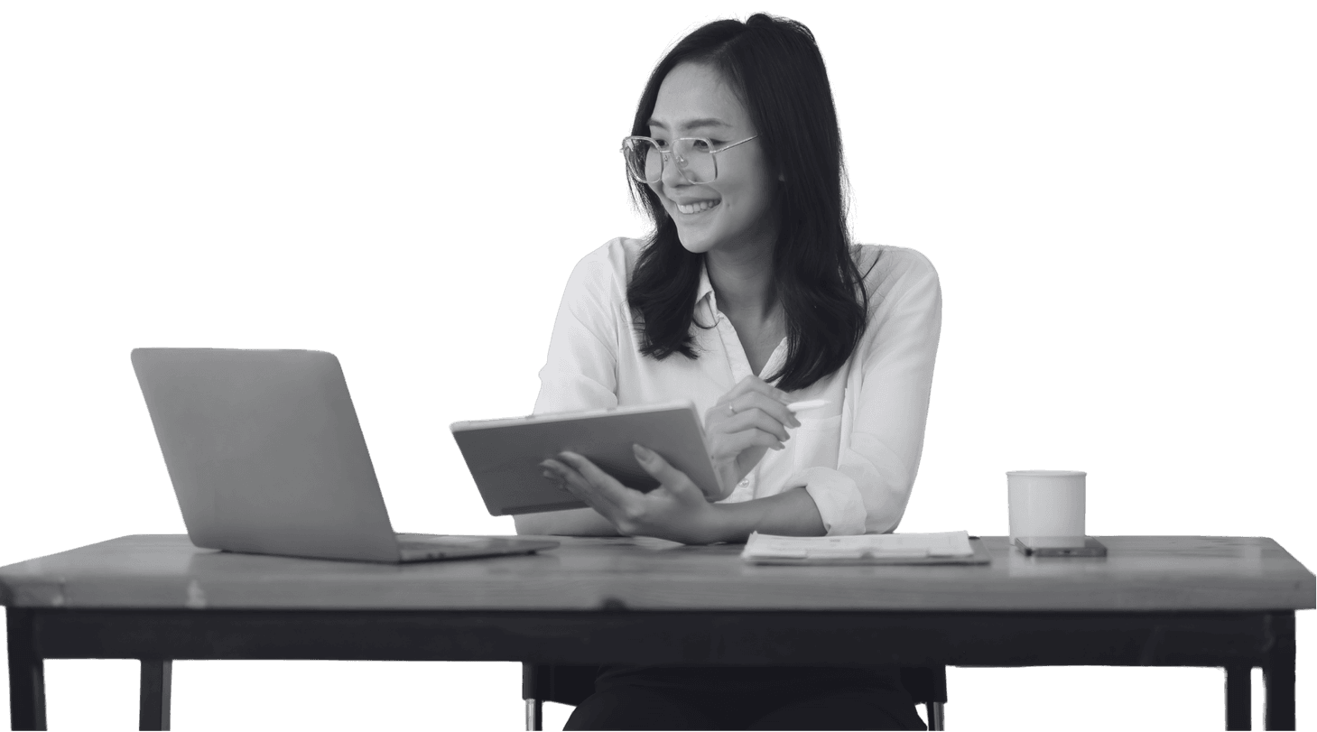 A content marketer reading through a draft at her desk