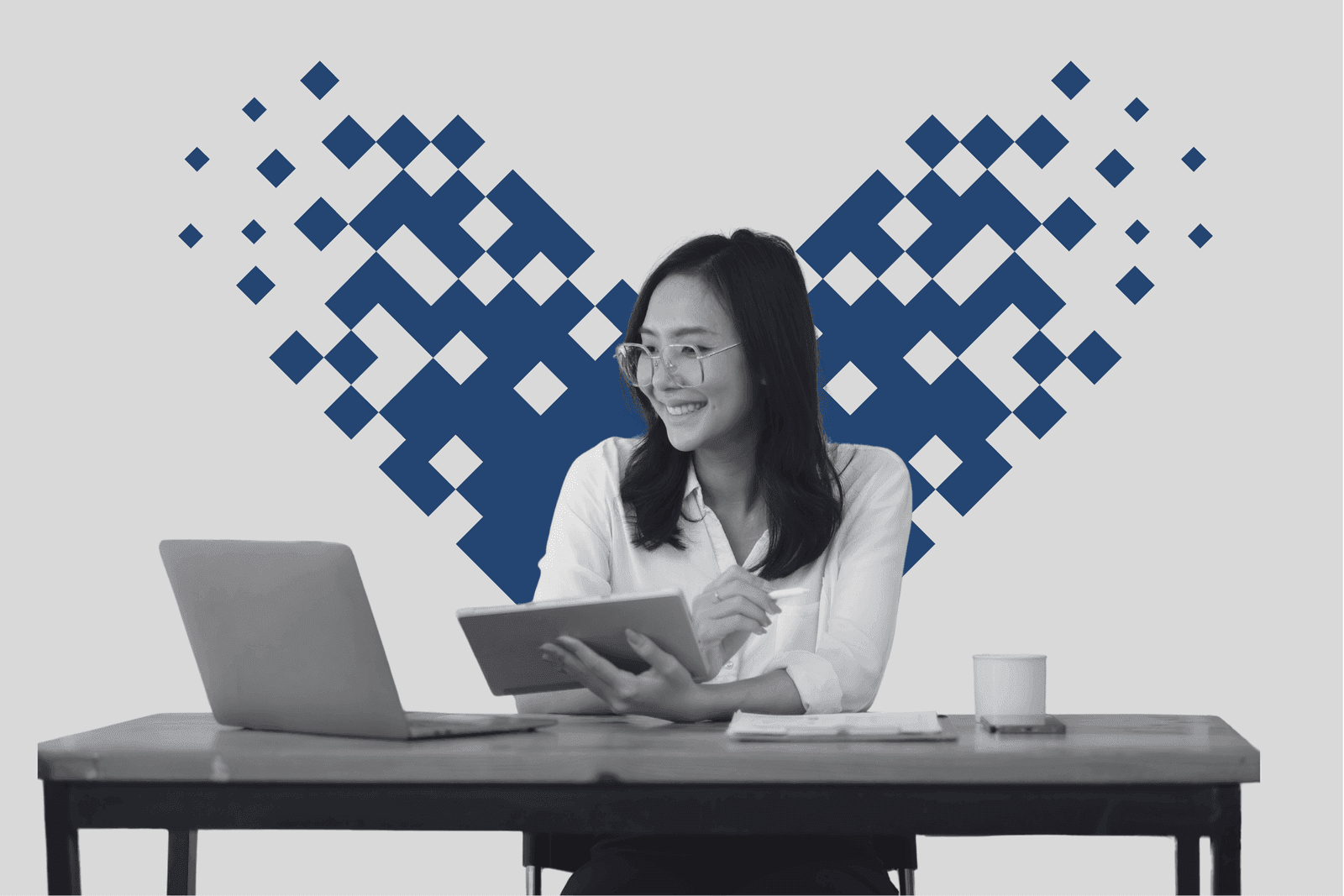 A content marketer at her desk framed by a pixel mosaic heart in azure