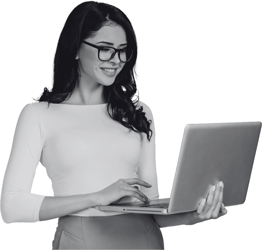 A marketer working from a laptop held in her arm