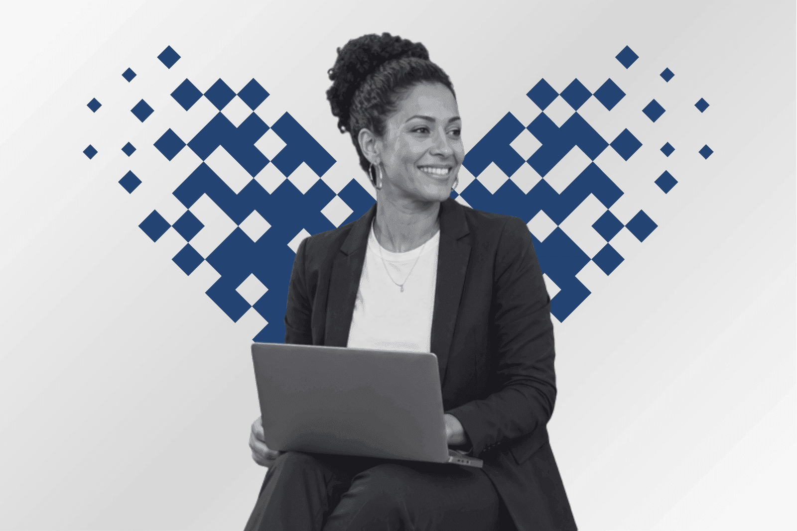 A marketing leader with a laptop framed by a pixel mosaic heart in azure